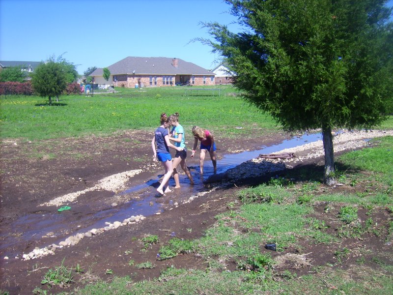 Holly, Taylor, and Hannah playing in the water