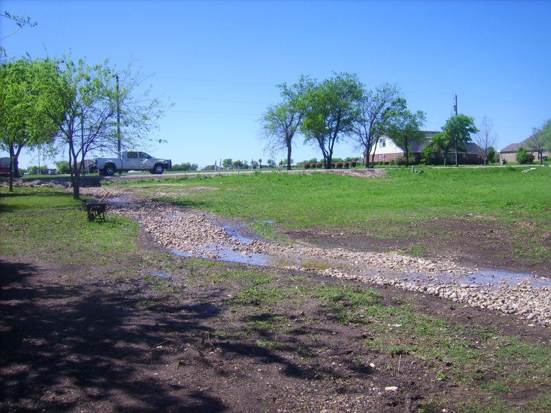 The water is still flowing from the drain pipe down the creek