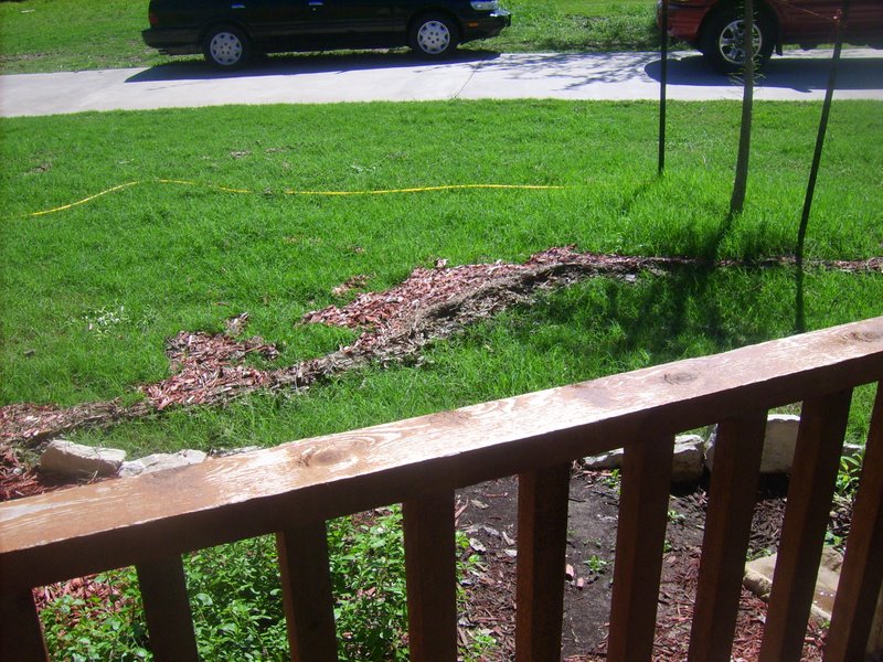 Mulch washed out onto the grass