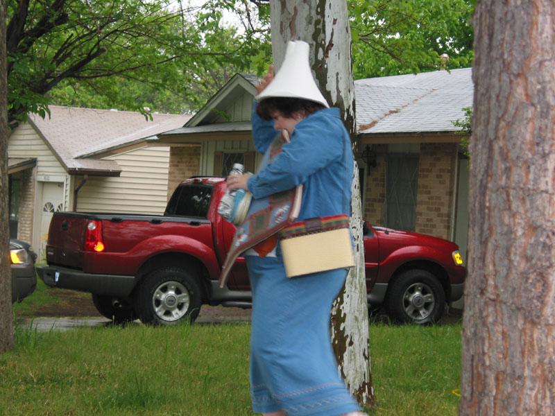 Lisa traipses through the rain, but her Energy Dome(tm) protects her.