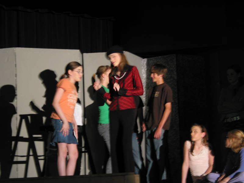 The director talks to an actor with a small part