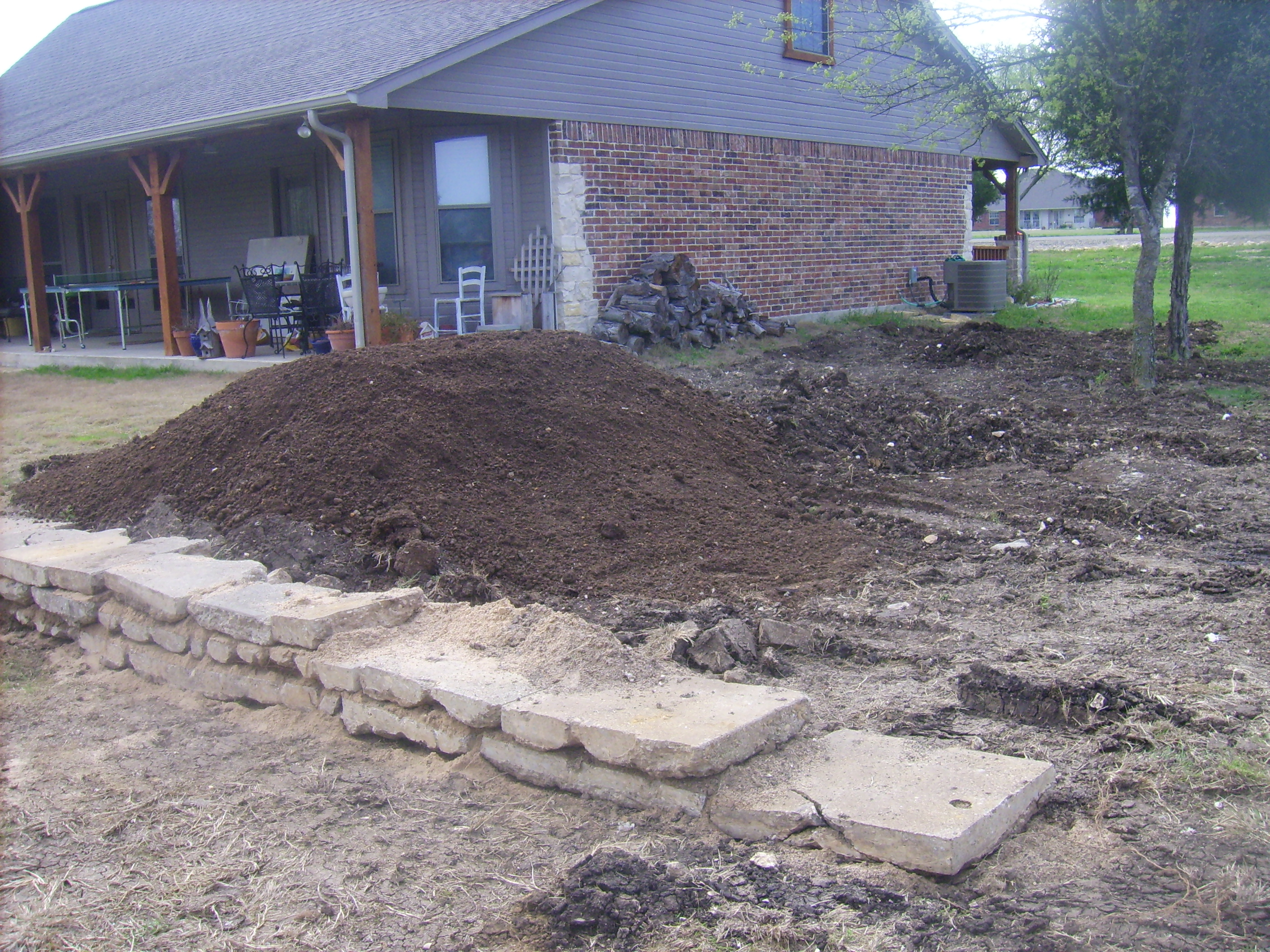 First load of topsoil and retaining wall extension.