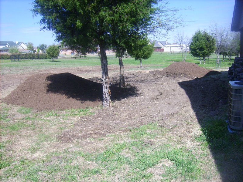 Two loads of topsoil ready to be spread