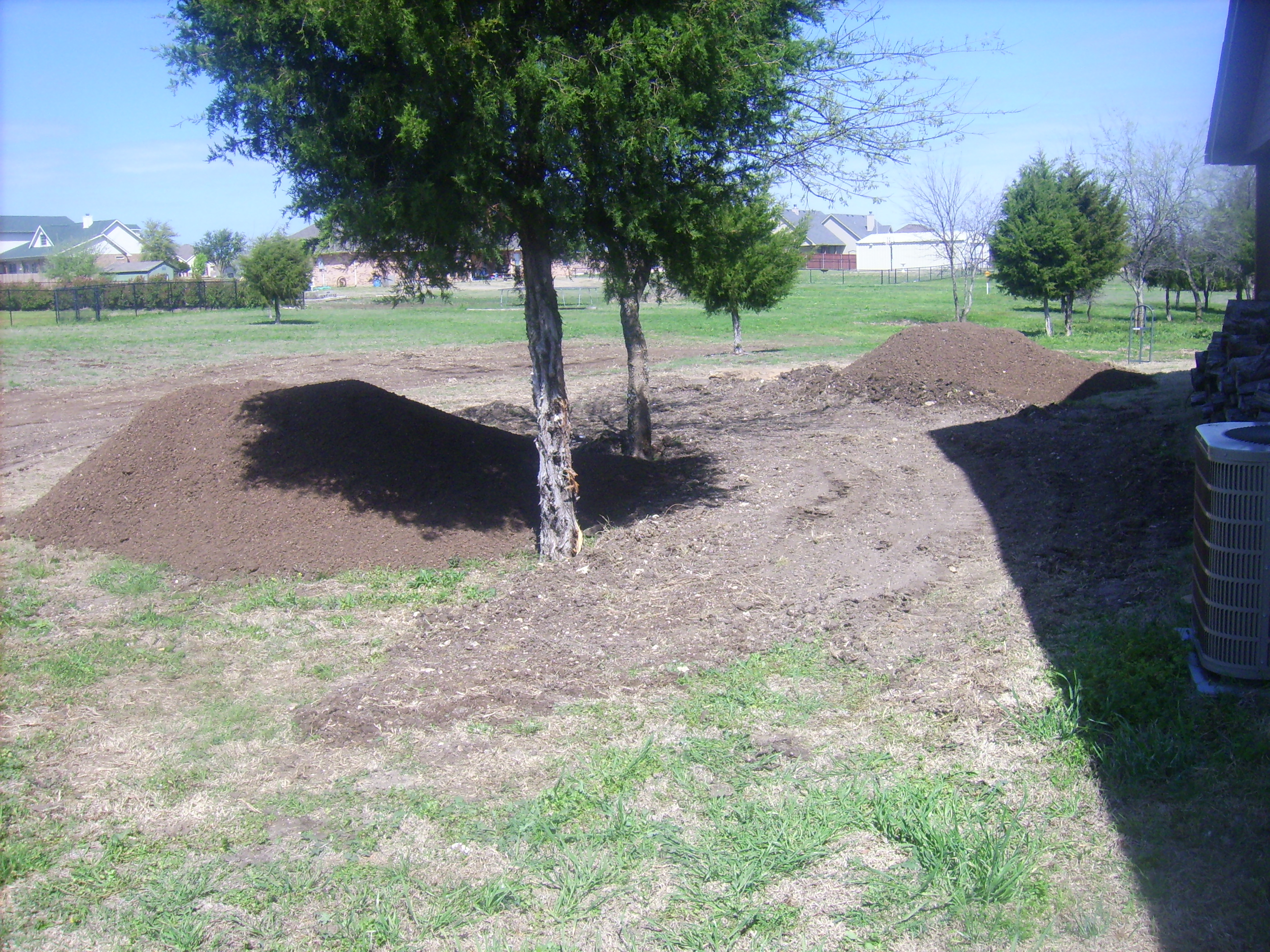 Two loads of topsoil ready to be spread