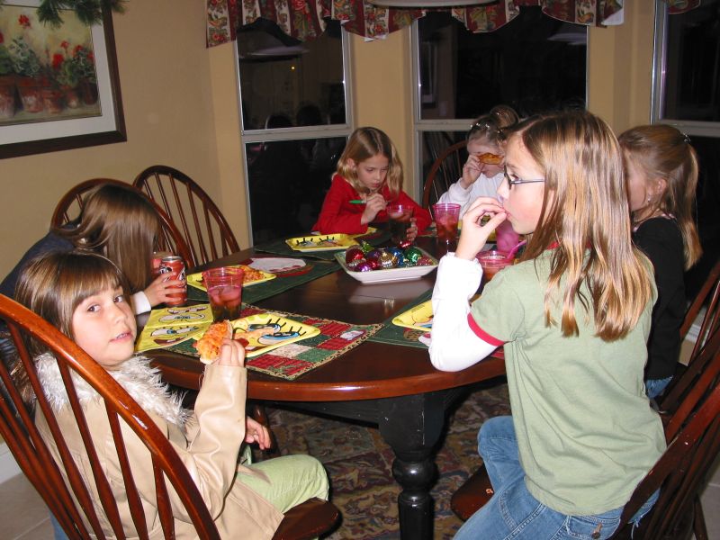 The girls start off the evening with some delicious pizza.