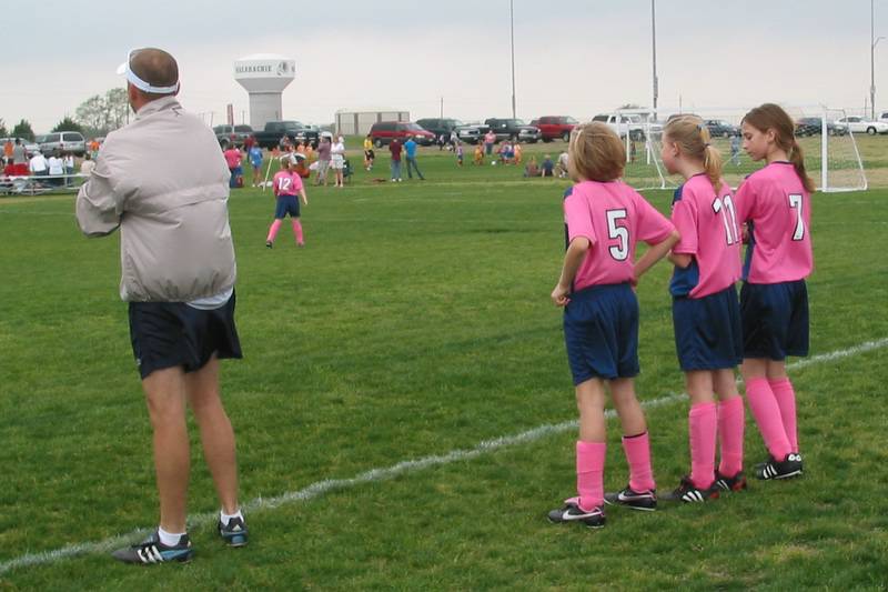 Lulu, Macie, and Holly on the sidelines