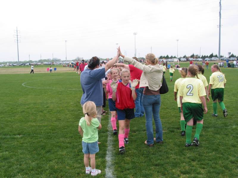 Lexi leads the Strikers as they emerge from the fan tunnel