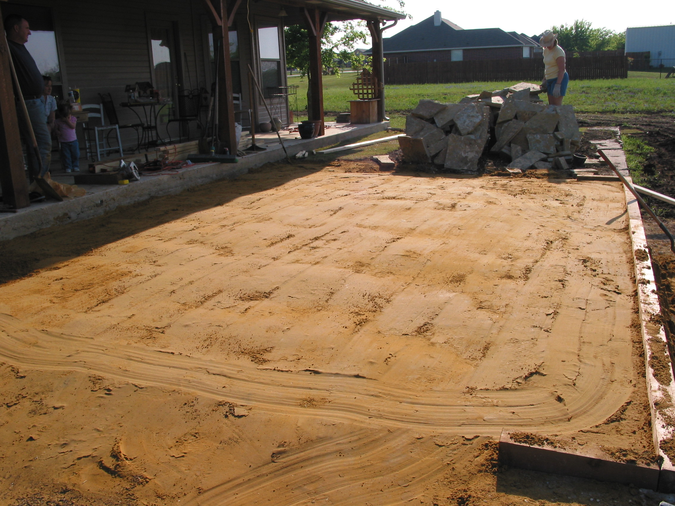 After using the compactory, we have a smooth bed to lay the stones on.