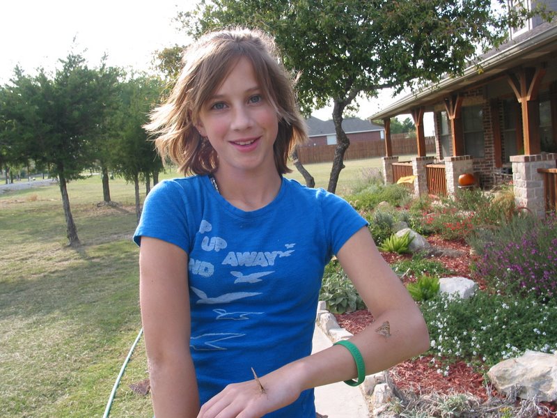 Holly has butterflies on her arms