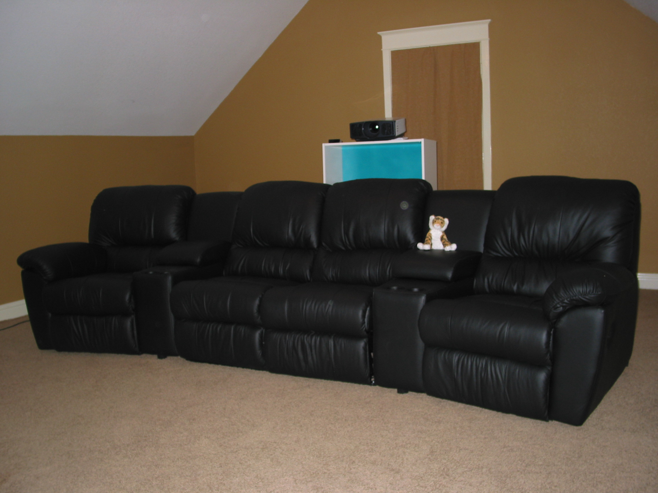 The new seating. View from the front left speaker. The projector is temporarily on a shelf until I get a ceiling mount.