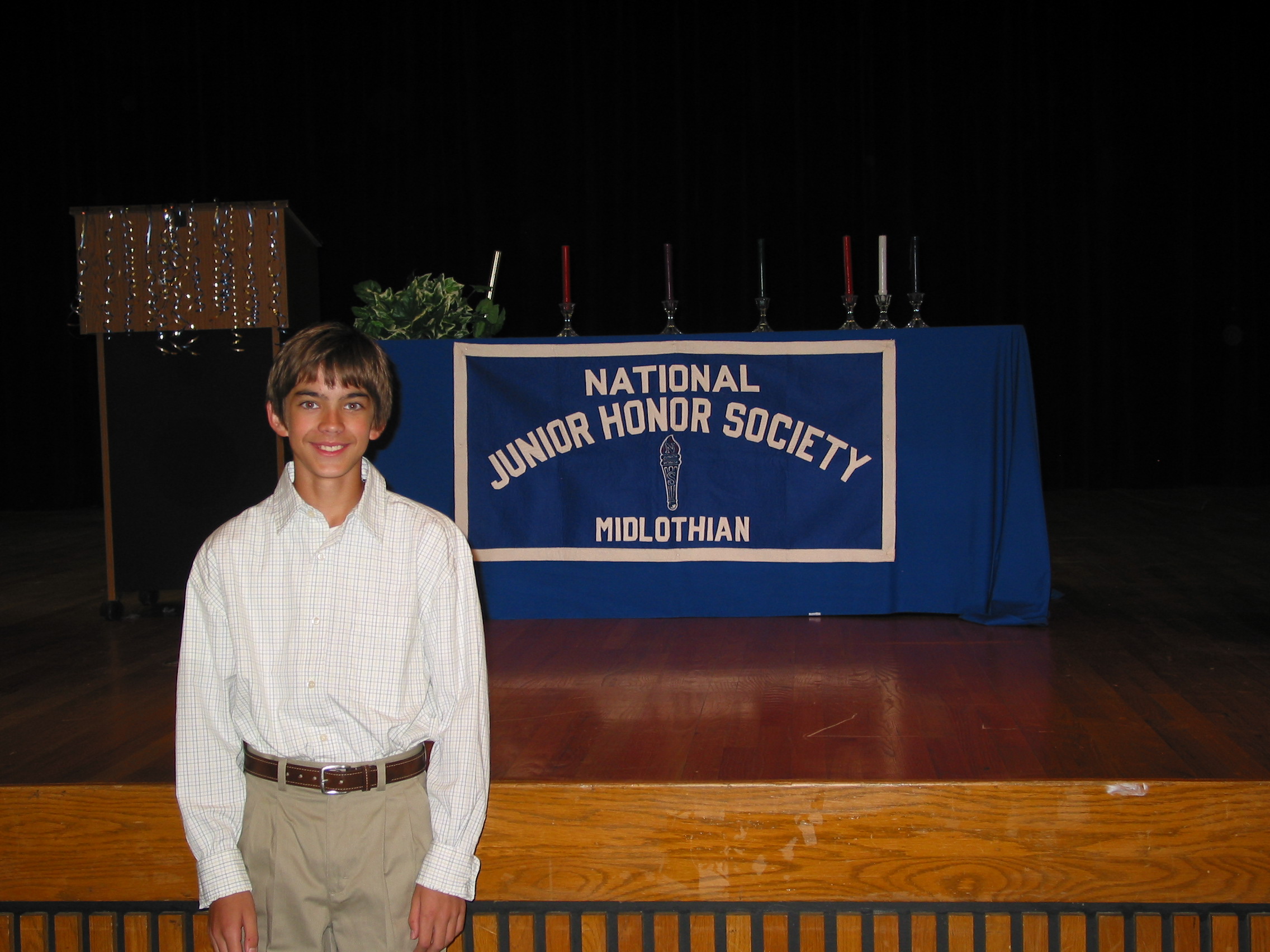 NJHS - Andrew poses with the banner.JPG
