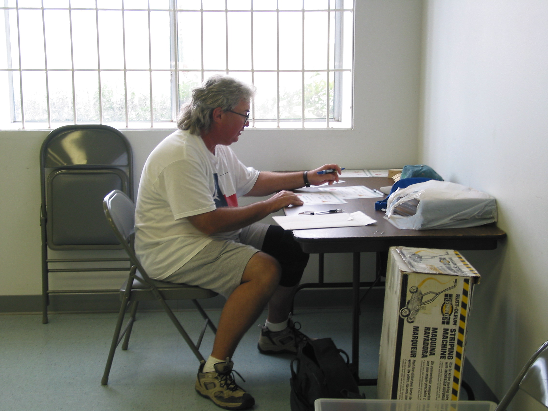 Dave Hughes, feverishly filling out the certificates.