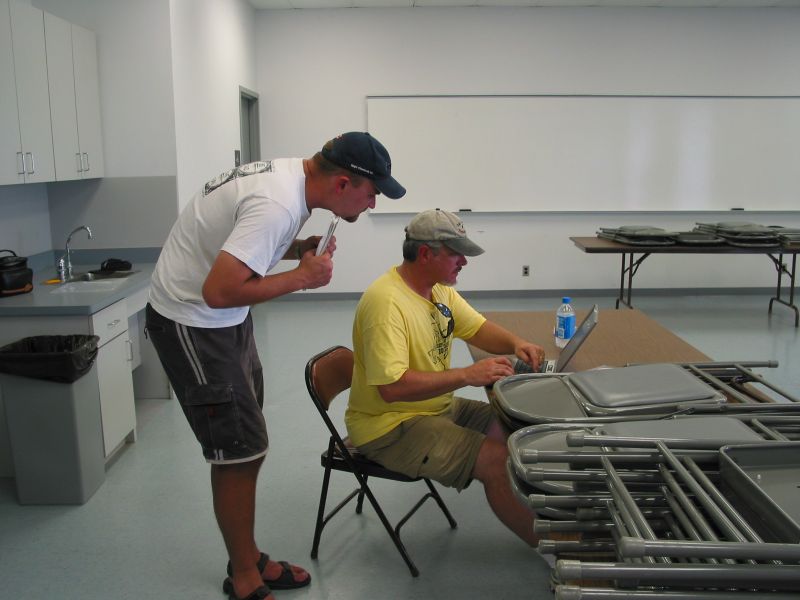 Andy and Pat crunching numbers on the laptop.