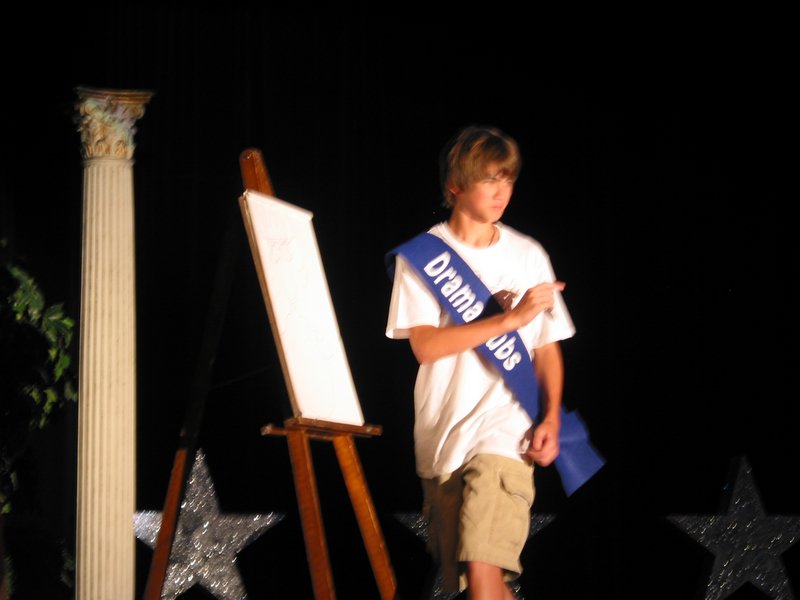 Ace is memorizing Miss Ellis County's features for the caricature