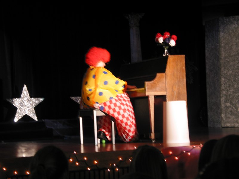 One of the other contestants clowns around during the talent portion