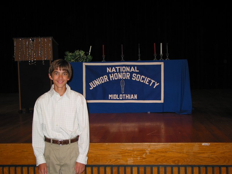NJHS - Andrew poses with the banner.JPG