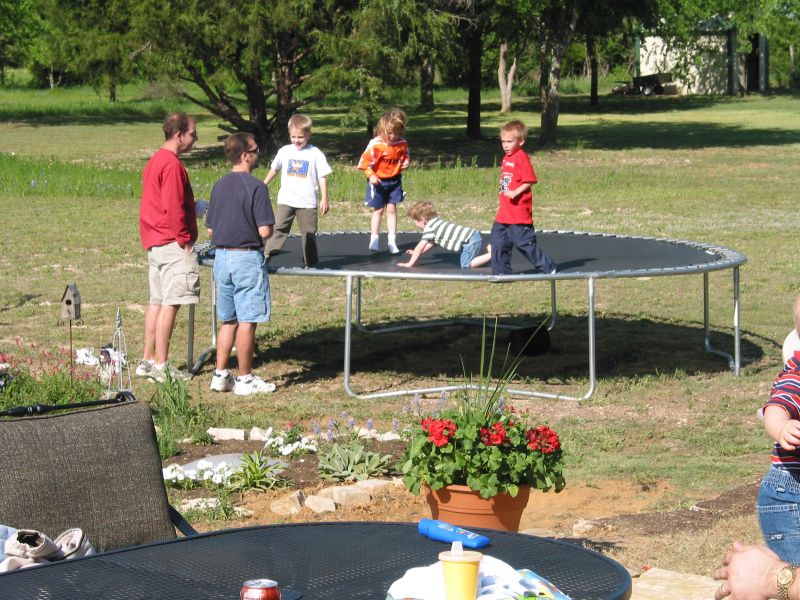 Cooper and Zlatar watch kids on the trampoline.