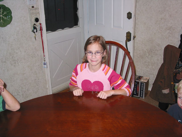 Holly patiently waiting for the cake and gifts
