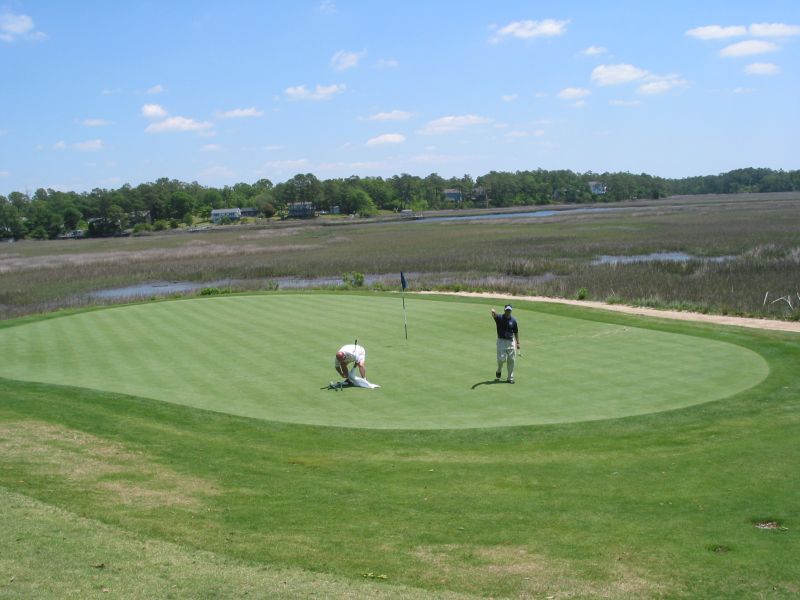 River's Edge - Bob and Timmy on the 14th Green