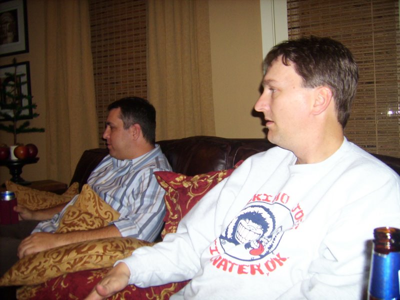 Ed and Leigh watch another late nighter play 'Golden Tee' golf
