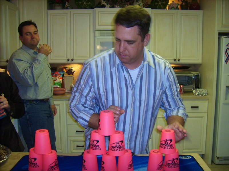 Shane can't believe a grown man (Ed) is playing with cups.