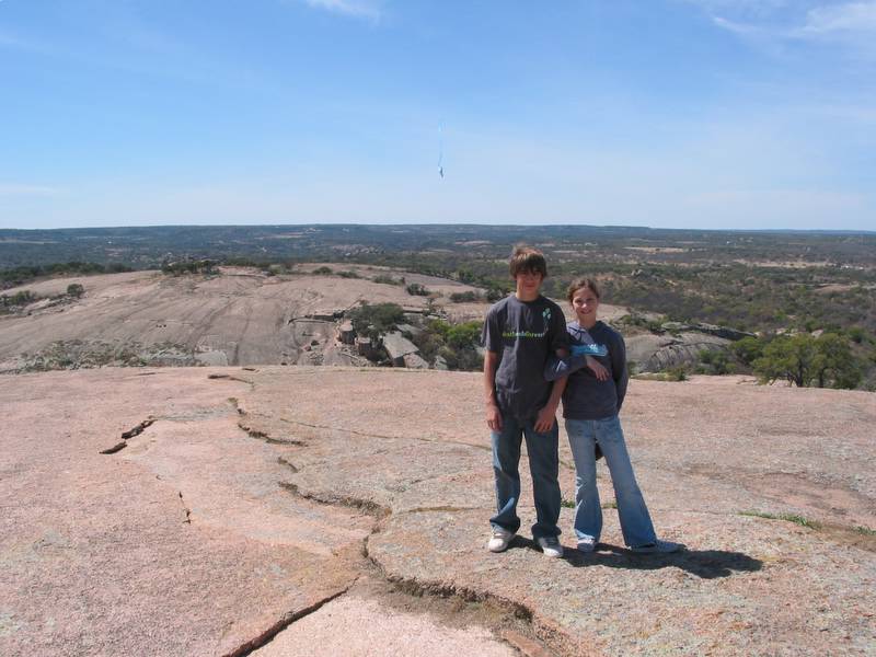 Andrew and Holly at the top with a kite and 'Little Rock' in the background